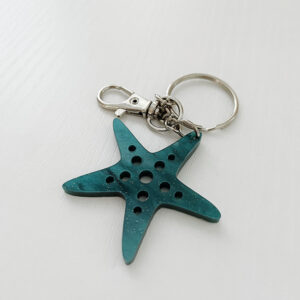 Starfish Keychain displayed on a white tabletop.